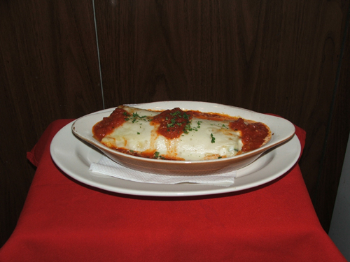Manicotti Alla Marinara with ricotta cheese and tomato sauce.