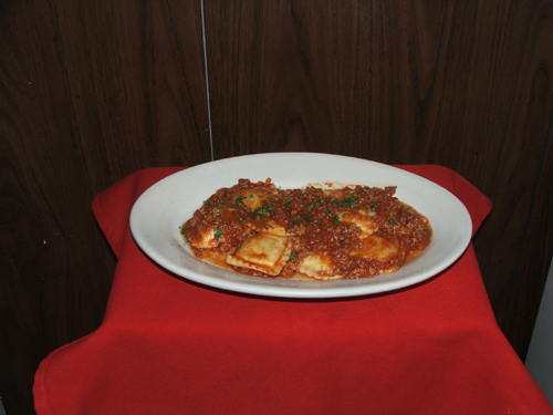 Ravioli Bolagnese. Stuffed beef or cheese with meat sauce.