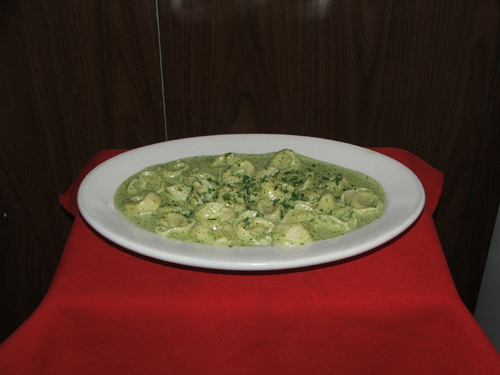 Tortollini Al Pesto. Stuffed with veal or cheese with a green pesto sauce.